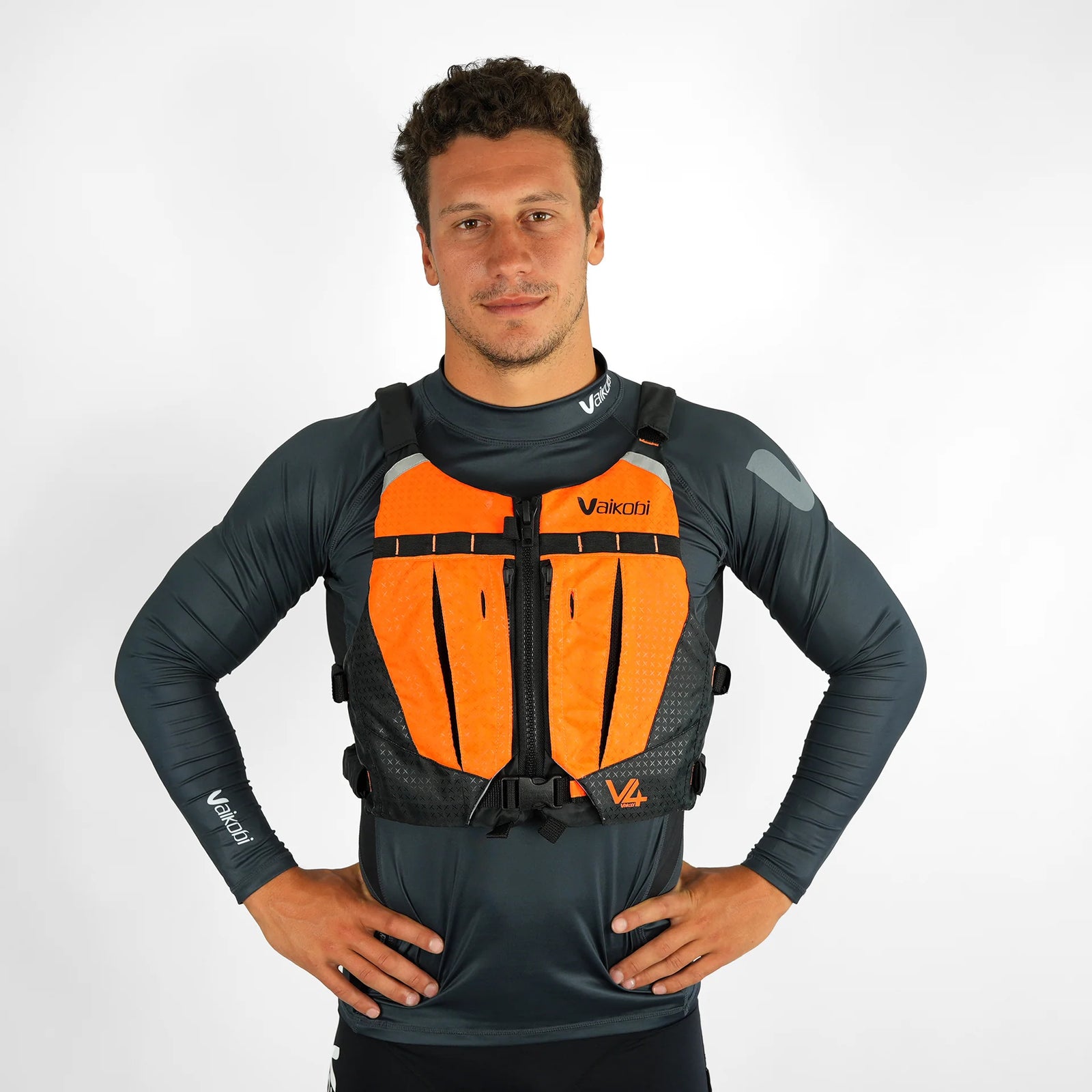 Front view of Vaikobi V4 Ocean Racing PFD Life Vest in bright orange, designed for enhanced visibility and safety during paddling.