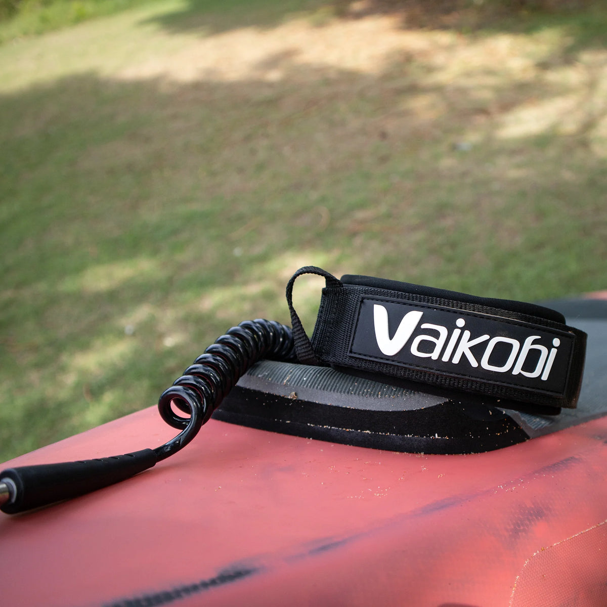 Vaikobi Fixed 1 Piece Calf Leash in use on surfski paddler&#39;s calf