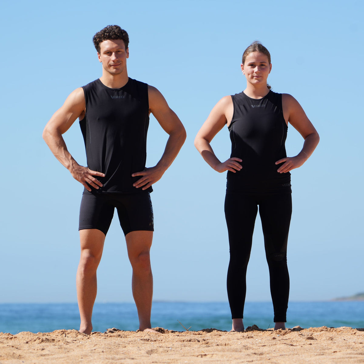 Vaikobi VCOLD Base Layer Vest black male and female models beach